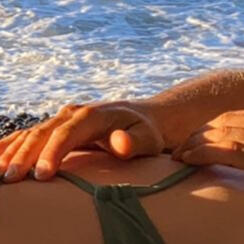 Adrian Thalasinos Haley providing Lomi Lomi massage on the beach